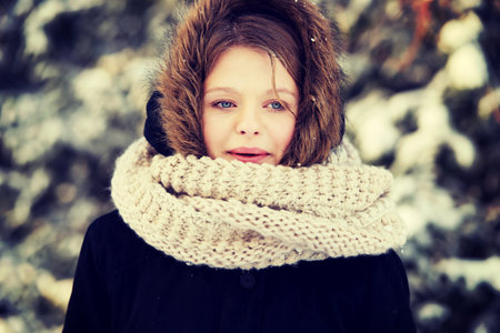Teenage woman in winter clothes outdoor