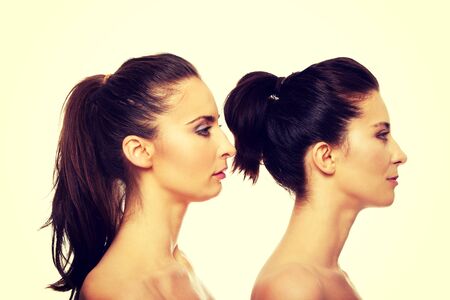 Beauty woman with make up standing behind her friend.の写真素材