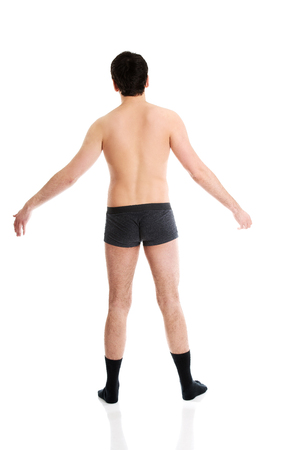 Young handsome shirtless man with arms wide open.の写真素材