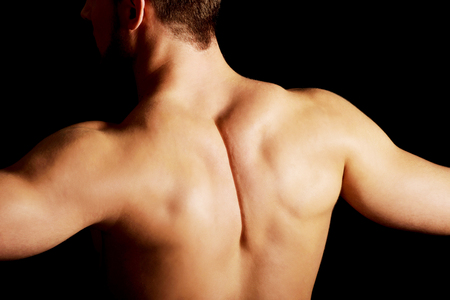 Sexy naked muscular man showing his muscular back.の写真素材