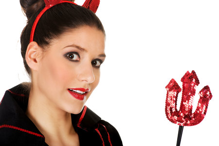 Beautiful woman in devil carnival costume.