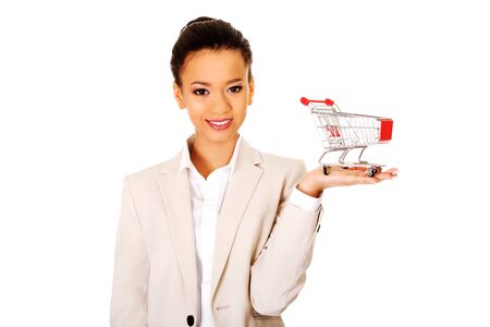 African businesswoman with shopping cart.の写真素材