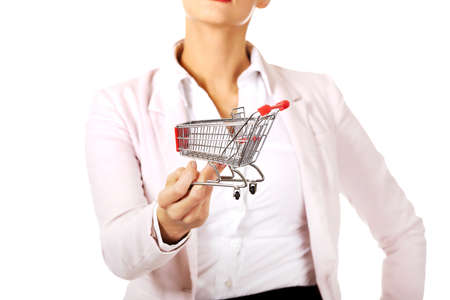 Attractive business woman holding small trolley.の写真素材