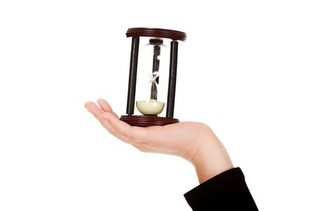 Young business woman holding hourglass-time concept.の写真素材