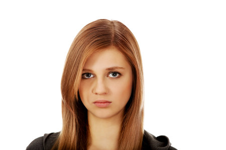 Portrait of teenage woman with serious face.