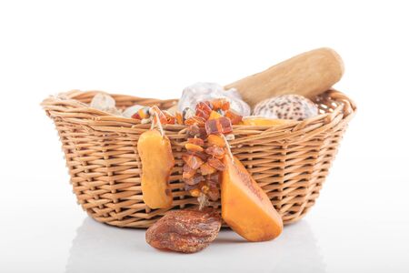 Willow basket with souvenirs from holiday.の写真素材