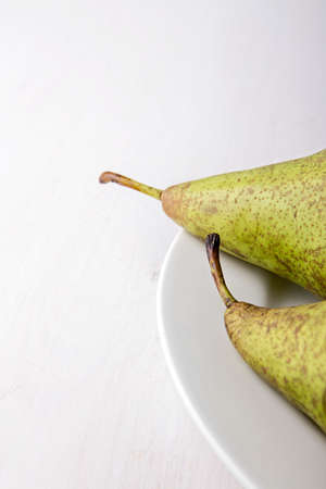 Two pears on white plate.の写真素材