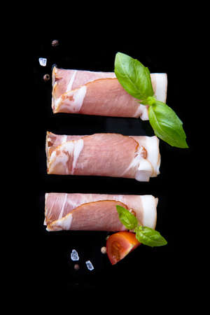 Black forest ham on black background.の写真素材