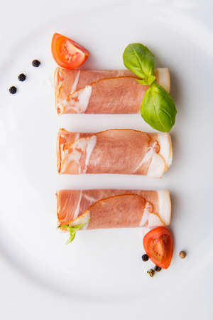 Black forest ham on white plate.の写真素材