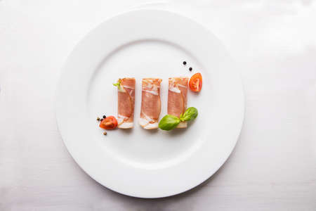 Black forest ham on white plate.の写真素材