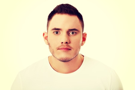 Portrait of young angry man.の写真素材