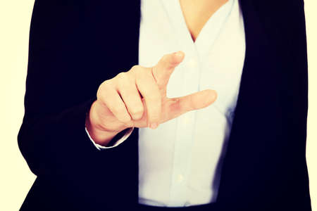 Business woman push virtual button.の写真素材