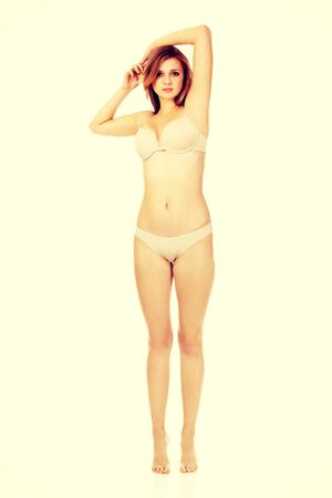 Teenage woman in beig underwear.の写真素材