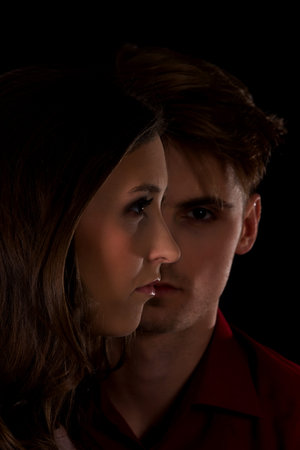 Dominating man is serious looking on a woman.