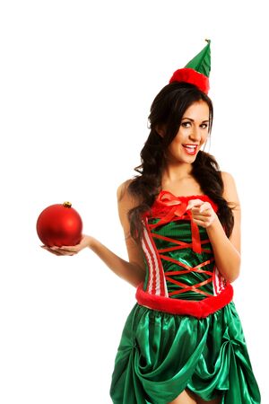 Woman in elf clothes holding christmas bubbleの写真素材