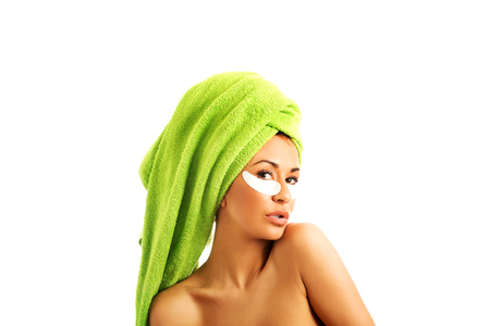 Spa serene woman with gel eye maskの写真素材