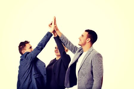 Business people giving high five.の写真素材