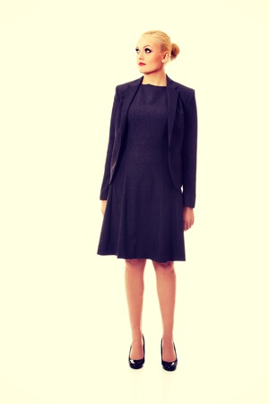 Beautiful business woman looking up at copy space or something.の写真素材