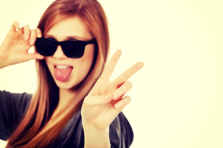 Young teenage woman wearing sunglasses.の写真素材