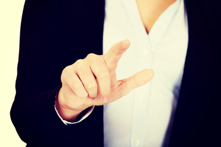 Business woman push virtual button.の写真素材