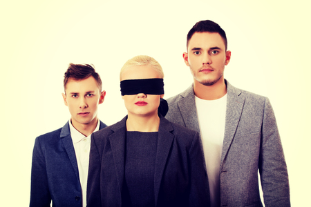 Business team-two man and blindfolded woman.の写真素材