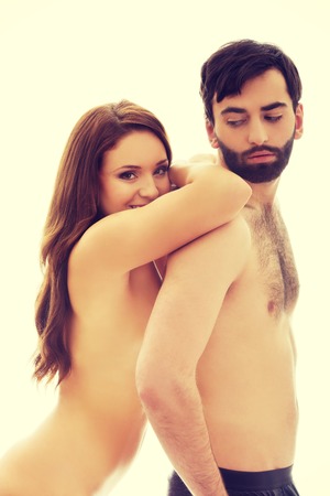 Beautiful woman leaning on man's back.の写真素材