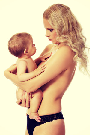 Young mother with her adorable baby.の写真素材