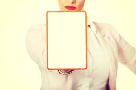 Young business woman holding a board with ban.の写真素材