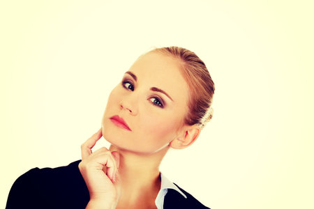 Young worried business woman thinking about something.の写真素材