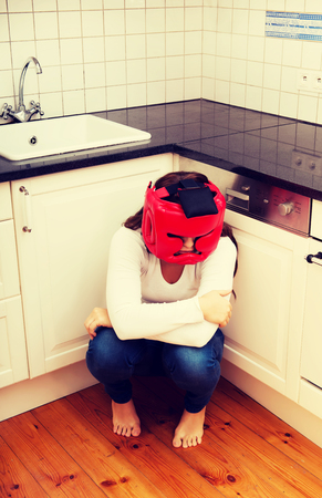 Young woman in fear of domestic abuse.の写真素材