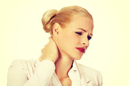 Business woman having huge neck pain.の写真素材