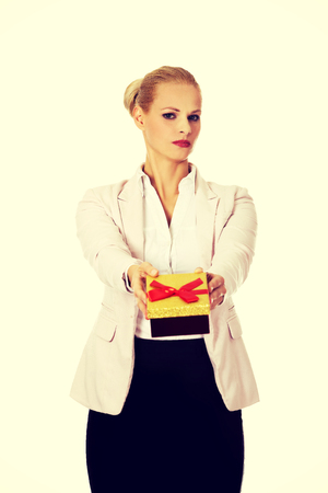 Business woman holding present box.の写真素材