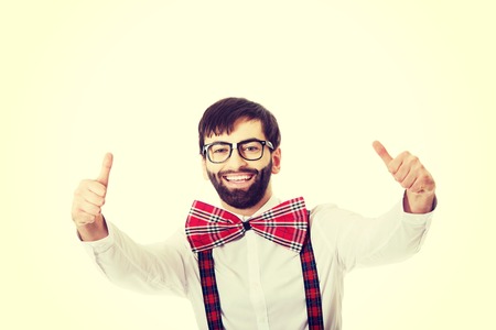 Funny handsome man wearing suspenders with ok sign.の写真素材