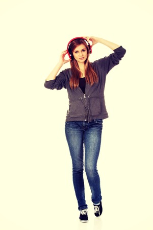 Teenage woman listening to the music.の写真素材