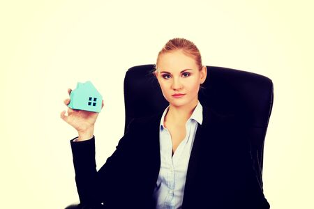 Young smile business woman sitting on a chair in office.の写真素材
