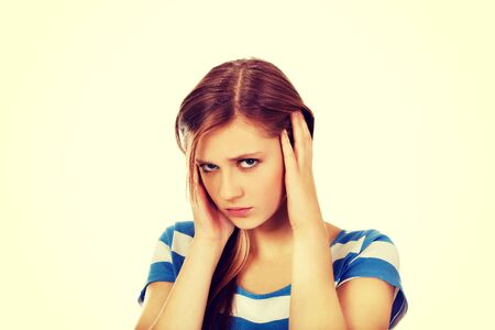 Young beautiful woman with headache.の写真素材