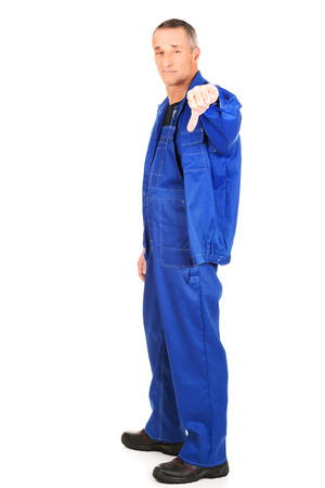 Mature repairman showing thumbs down.の写真素材