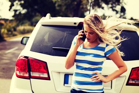 Young woman calling for help.の写真素材