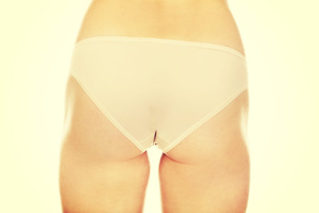 Young woman bottom in panties.