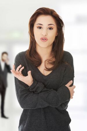 Young beautiful woman with folded armsの写真素材