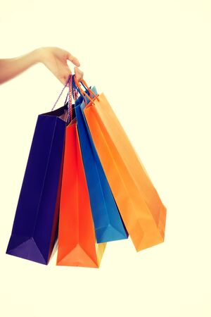 Woman hand with a lot of shopping bags.の写真素材