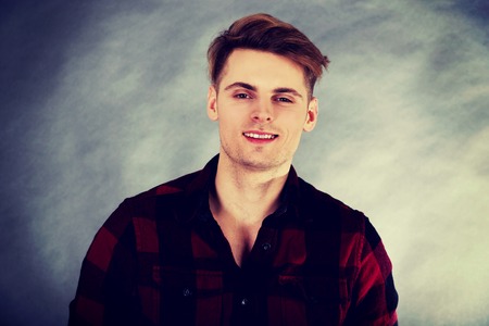 Young handsome man smiling to camera.の写真素材