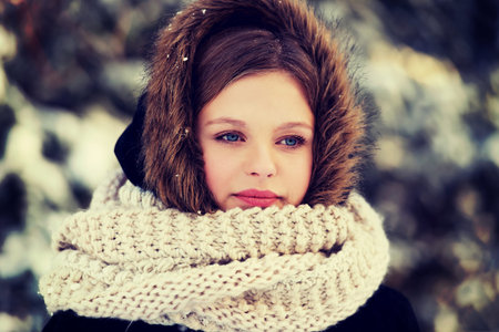 Teenage woman in winter clothes outdoorの写真素材