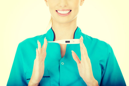 Beautiful doctor woman with a thermometer.