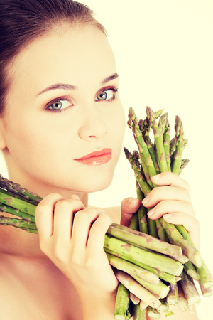 Woman with healthy food - asparagusの写真素材