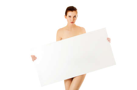 Young woman with empty board. Isolated on white.の写真素材