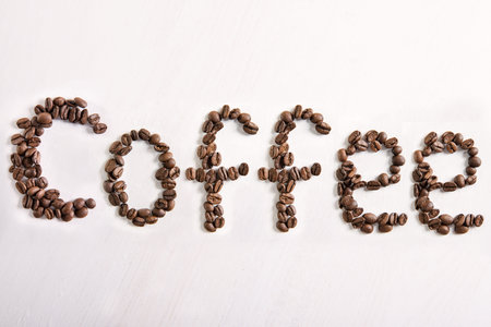 The word coffee from coffee beans.