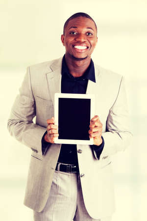 Businessman showing tablet computerの写真素材