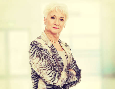 Portrait of elder woman. Isolated on white.の写真素材