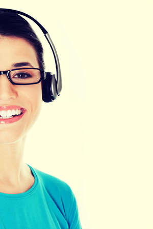 Casual woman with microphone and headphones. isolated on white.の写真素材